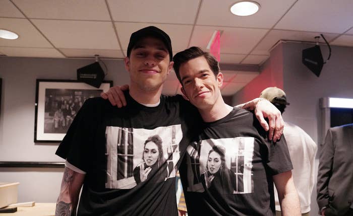 Pete and John with their arms around each other as they pose for a photo while both wearing identical t-shirts with a photo of John&#x27;s ex-wife Anna-Marie Tendler