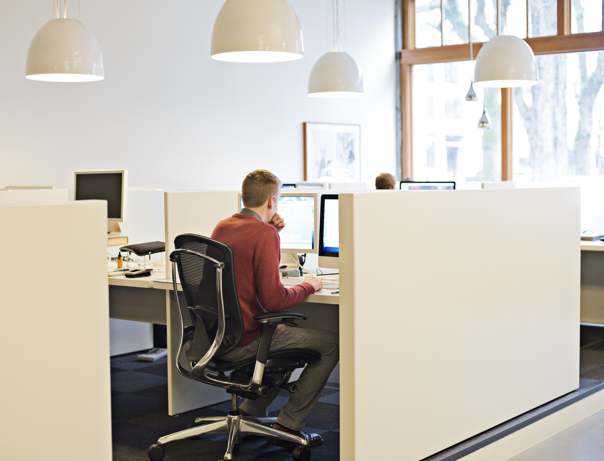 A person working in a cubicle