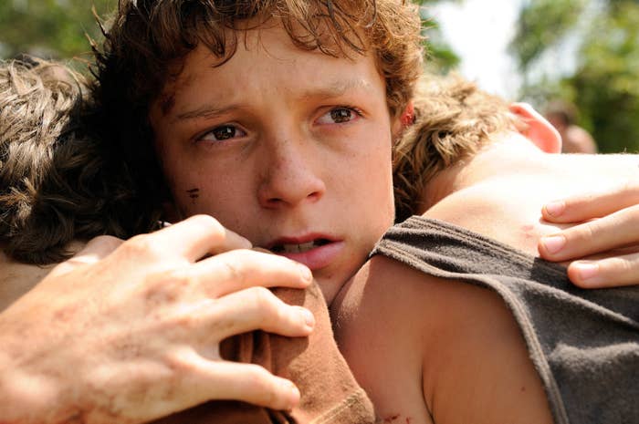 Tom's character in The Impossible hugging two other people
