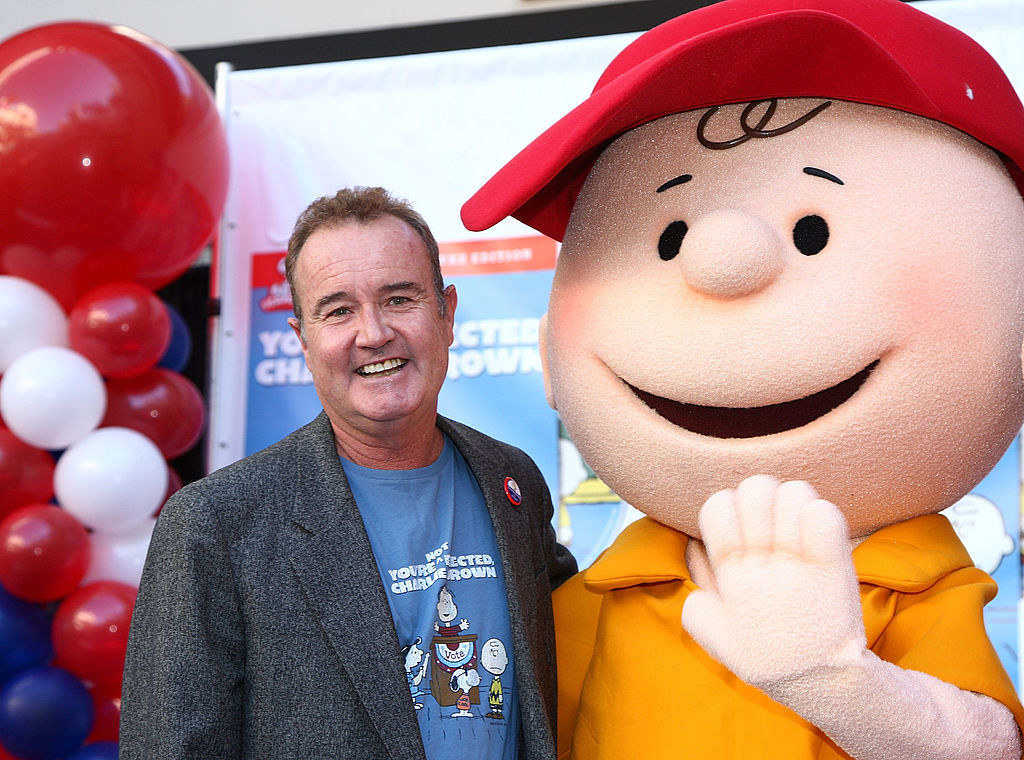 Peter poses with Charlie Brown mascot