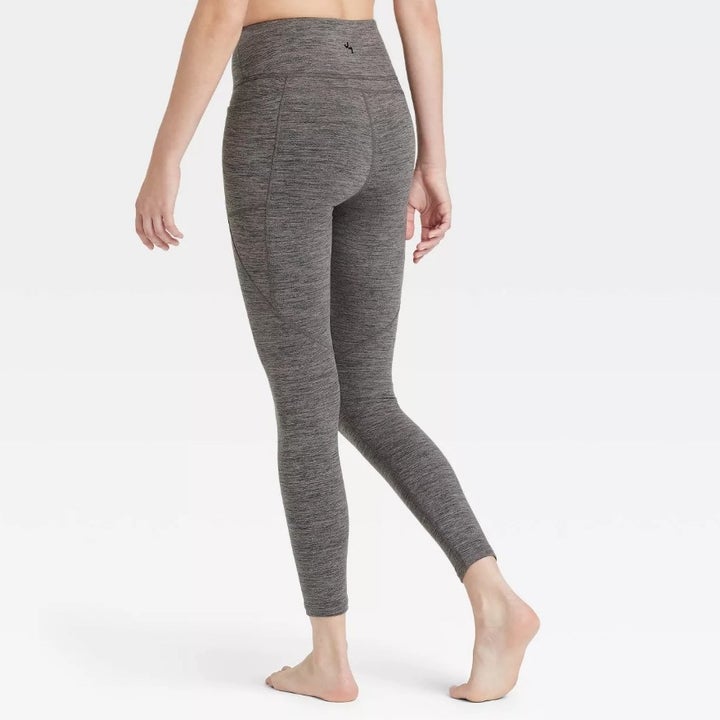 Model wearing the charcoal grey space-dye leggings