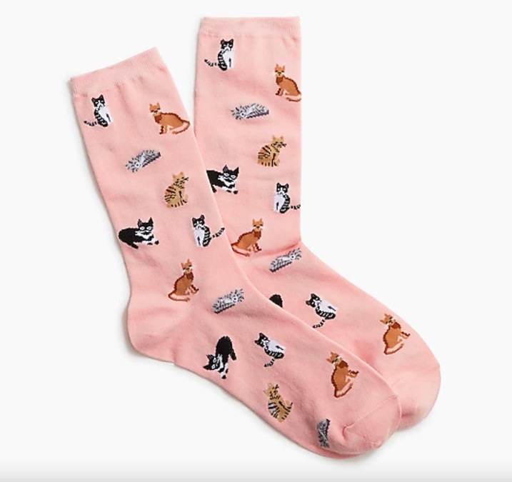 Pink trouser socks with cats all over them