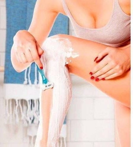 An image of a model using sensitive skin shave gel inside the shower