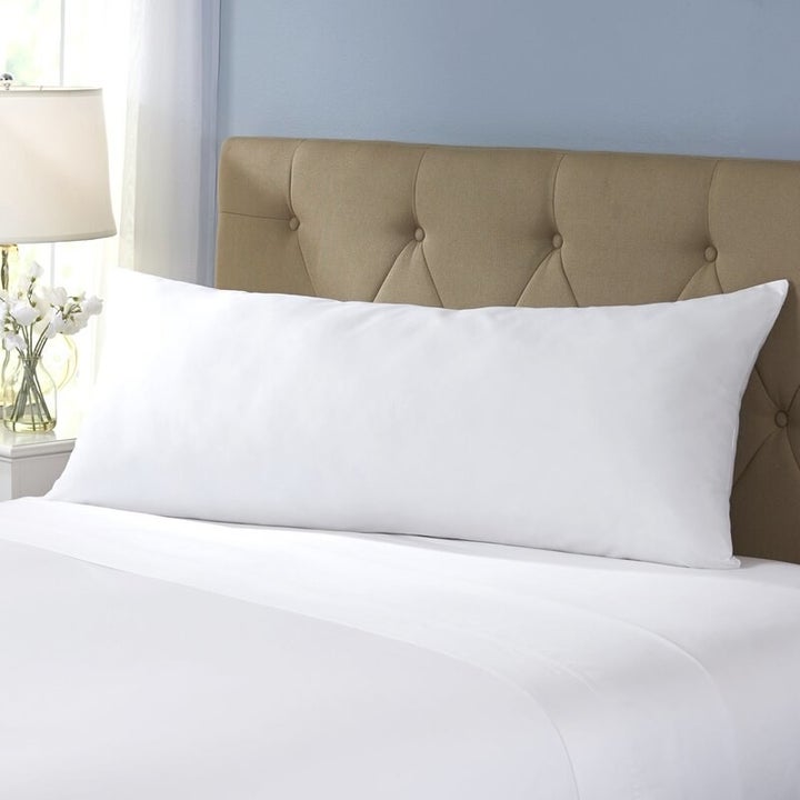 A white body pillow in a home