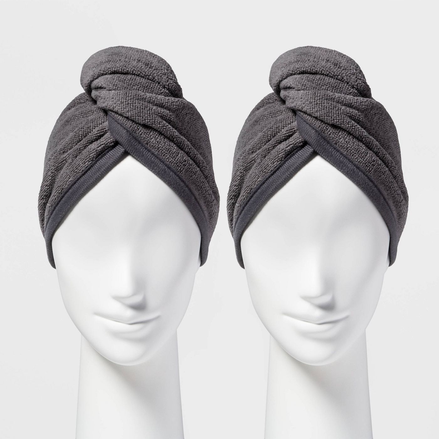 An image of two mannequins wearing grey bath hair wraps