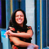 Melissa Fumero as Amy Santiago smiles as she begins to wave her arms around and shake her head wildly in &quot;Brooklyn Nine-Nine&quot;