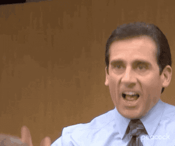 Michael Scott loves the ideas his employees are giving him during a conference room meeting