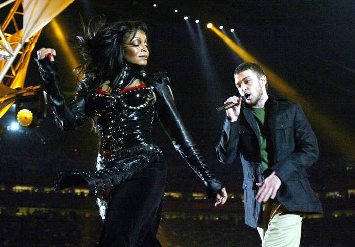 Justin singing as he walks behind Janet onstage during their Super Bowl performance