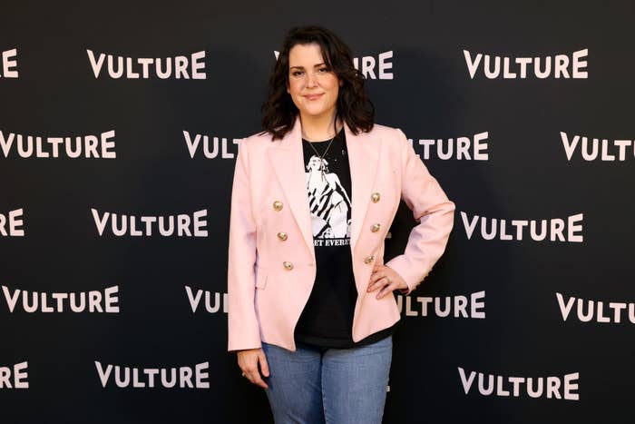 Melanie on the red carpet in jeans, a T-shirt, and a short jacket