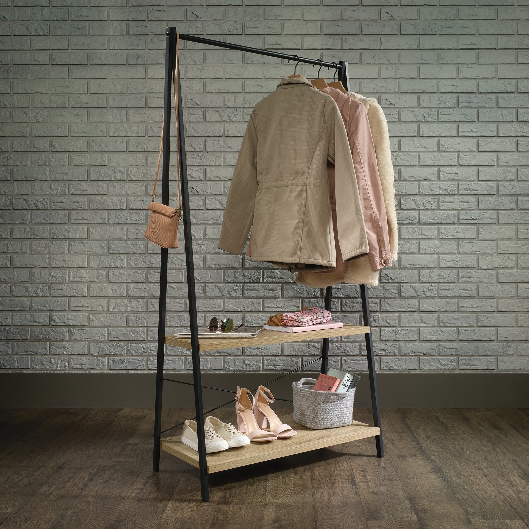 32&quot; clothes rack with shoes and clothes on hangers in the middle of a room
