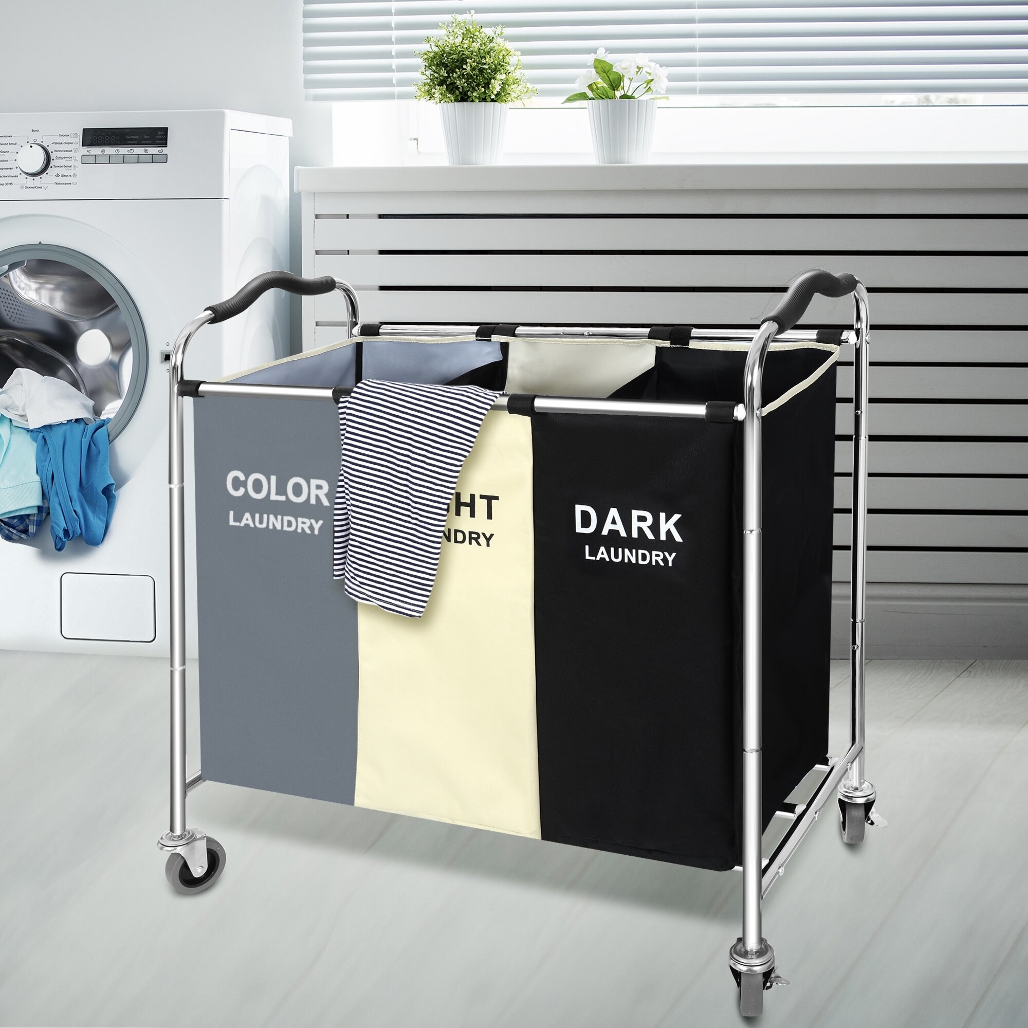 Three bag hamper in laundry room with color, light and dark