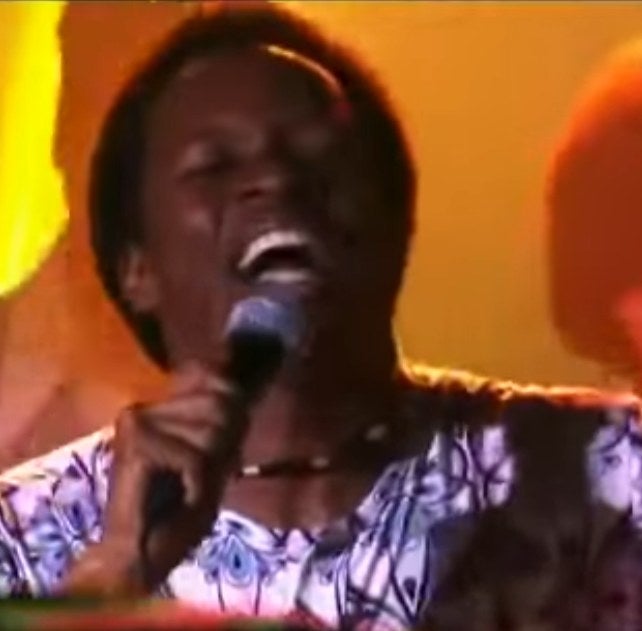 Wilson singing to a crowded club