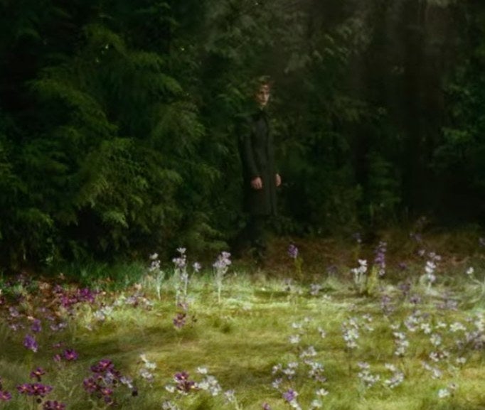 Edward wearing a long jacket and pants