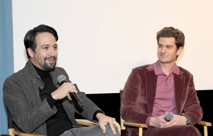 Miranda sits next to Garfield in directors' chairs