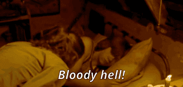 Ron lifts his blanket up over his vest and says &quot;bloody hell&quot; when Hermione wakes him up in bed.