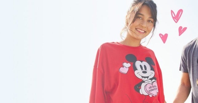Model is wearing a red sweatshirt with Mickey Mouse and the other model is wearing a grey T-Shirt of Mickey Mouse
