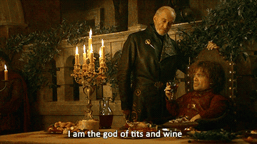 Charles Dance as Tywin Lannister looking down at Peter Dinklage as Tyrion Lannister who is saying &quot;I am the god of tits and wine&quot;