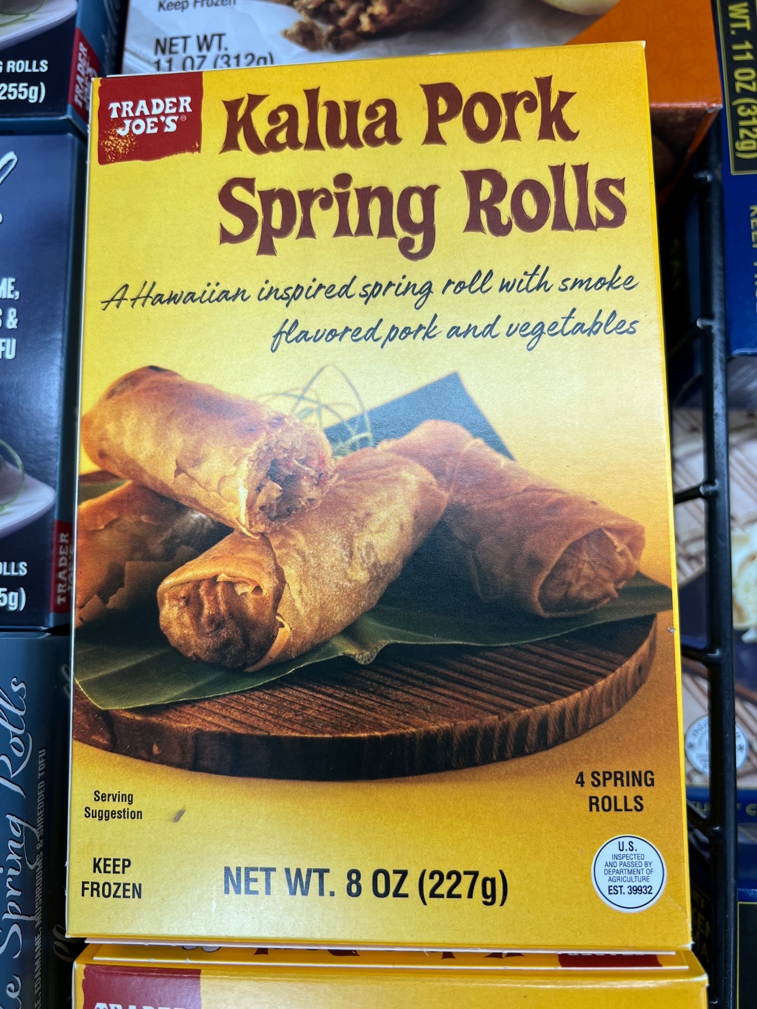A box of Kalua Pork Spring Rolls