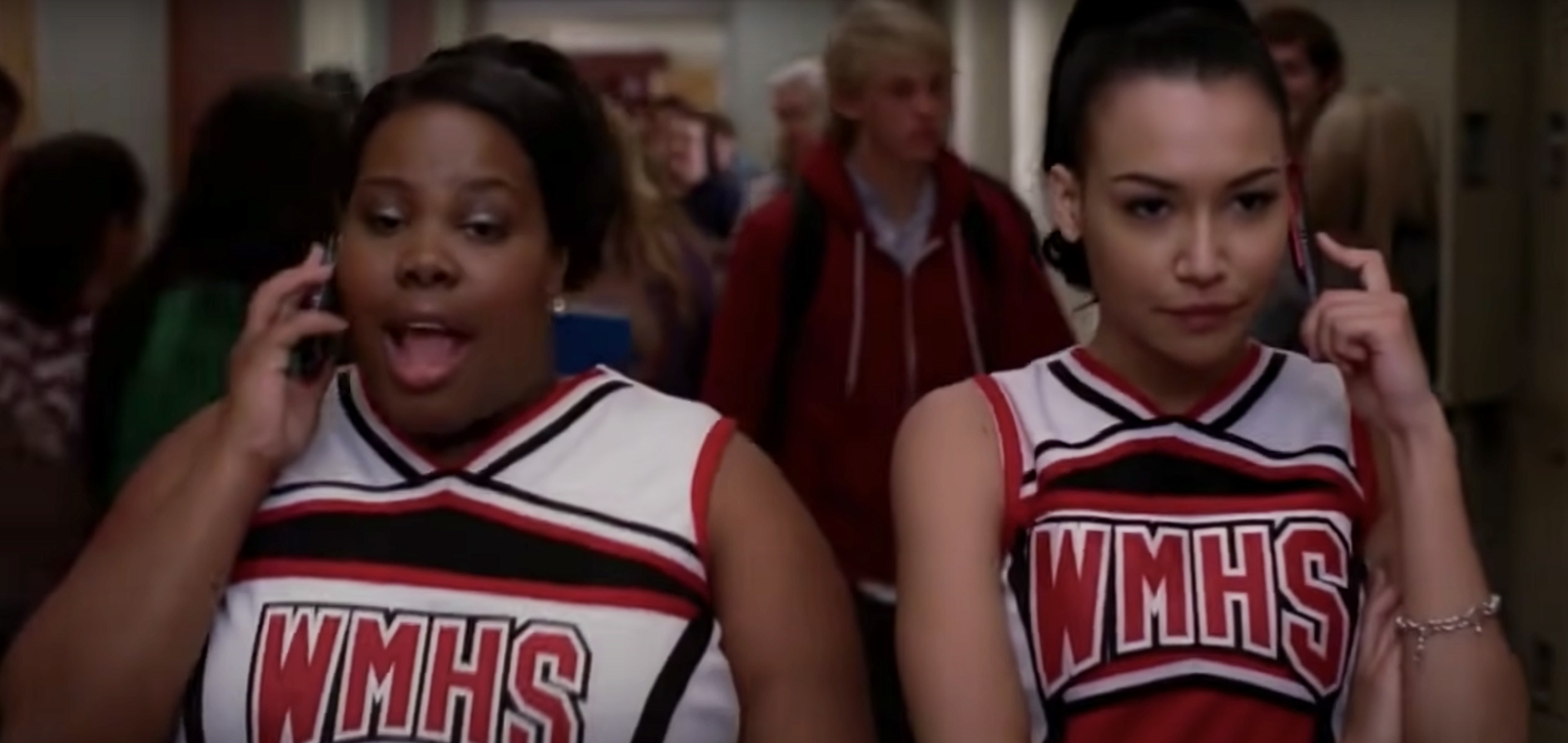 Mercedes and Santana singing in the hallway