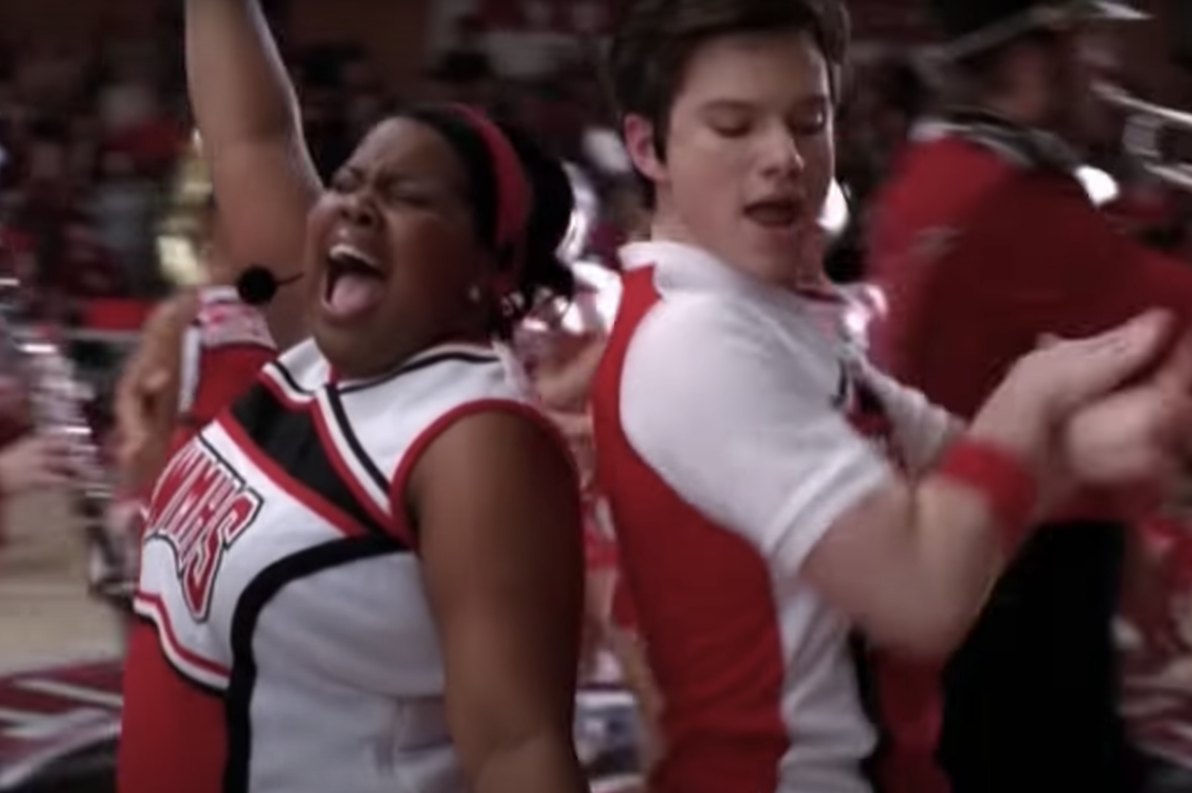 Mercedes and Kurt in Cheerios uniforms singing and performing with the Cheerios