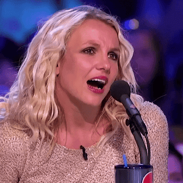 Britney Spears looks on with furrowed brows as her jaw drops on X Factor