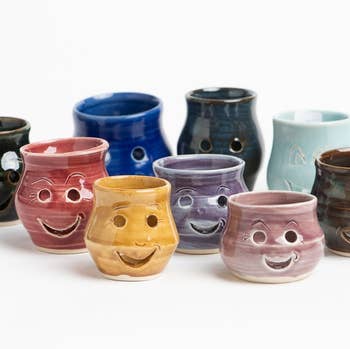 nine different color egg separators that look like smiles