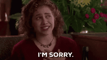 Brittany Murphy in Clueless cries, says I&#x27;m sorry, and then bangs her head in the table