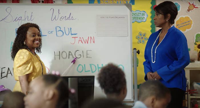 Janine (Quinta Brunson) stands in front of a whiteboard with words written on it as Barbara (Sheryl Lee Ralph) looks on