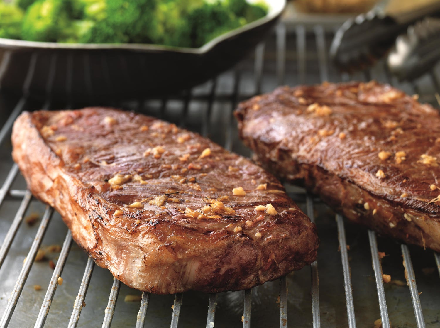 Two steaks on a grill