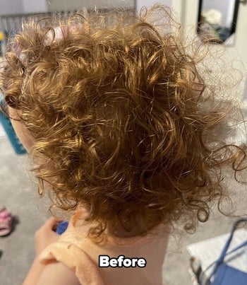 a reviewer's child with frizzy curly hair labeled 