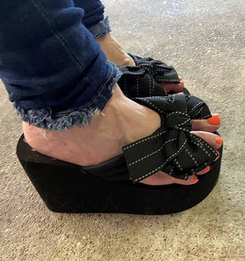 Reviewer wearing black platform sandals