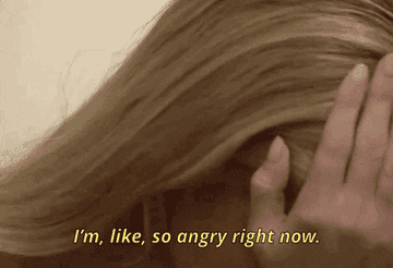 girl holding her head in her hands, saying &quot;i&#x27;m so angry right now&quot;
