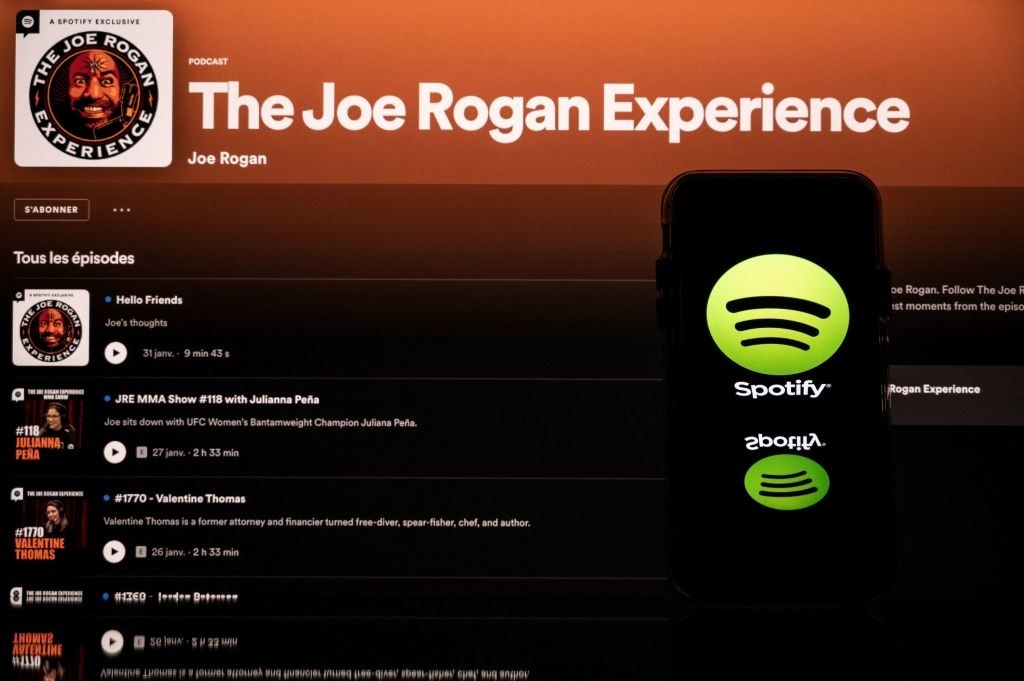Spotify app next to the Joe Rogan podcast playlist