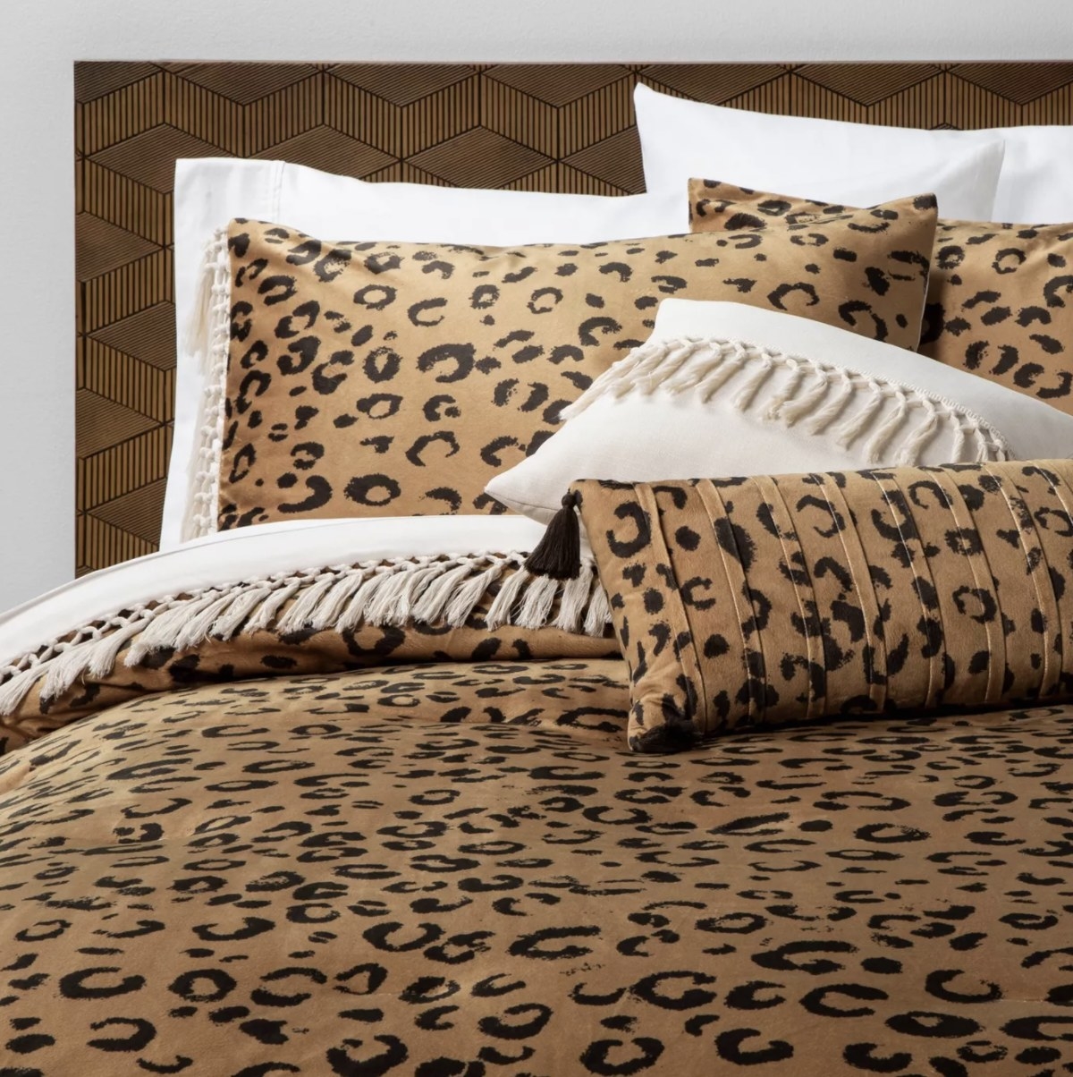 The animal print bed set is has light fringe, a gold base and black markings