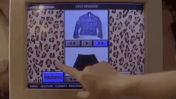 a gif from Clueless of Cher adjusting her outfit options on the computer