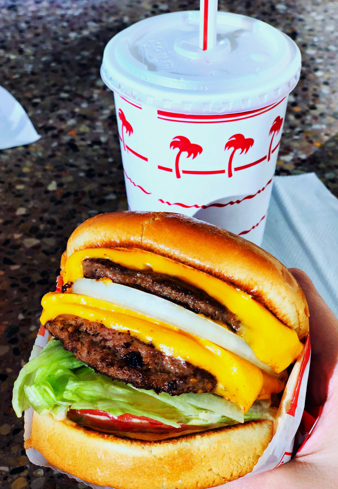 An In-N-Out burger and softdrink.