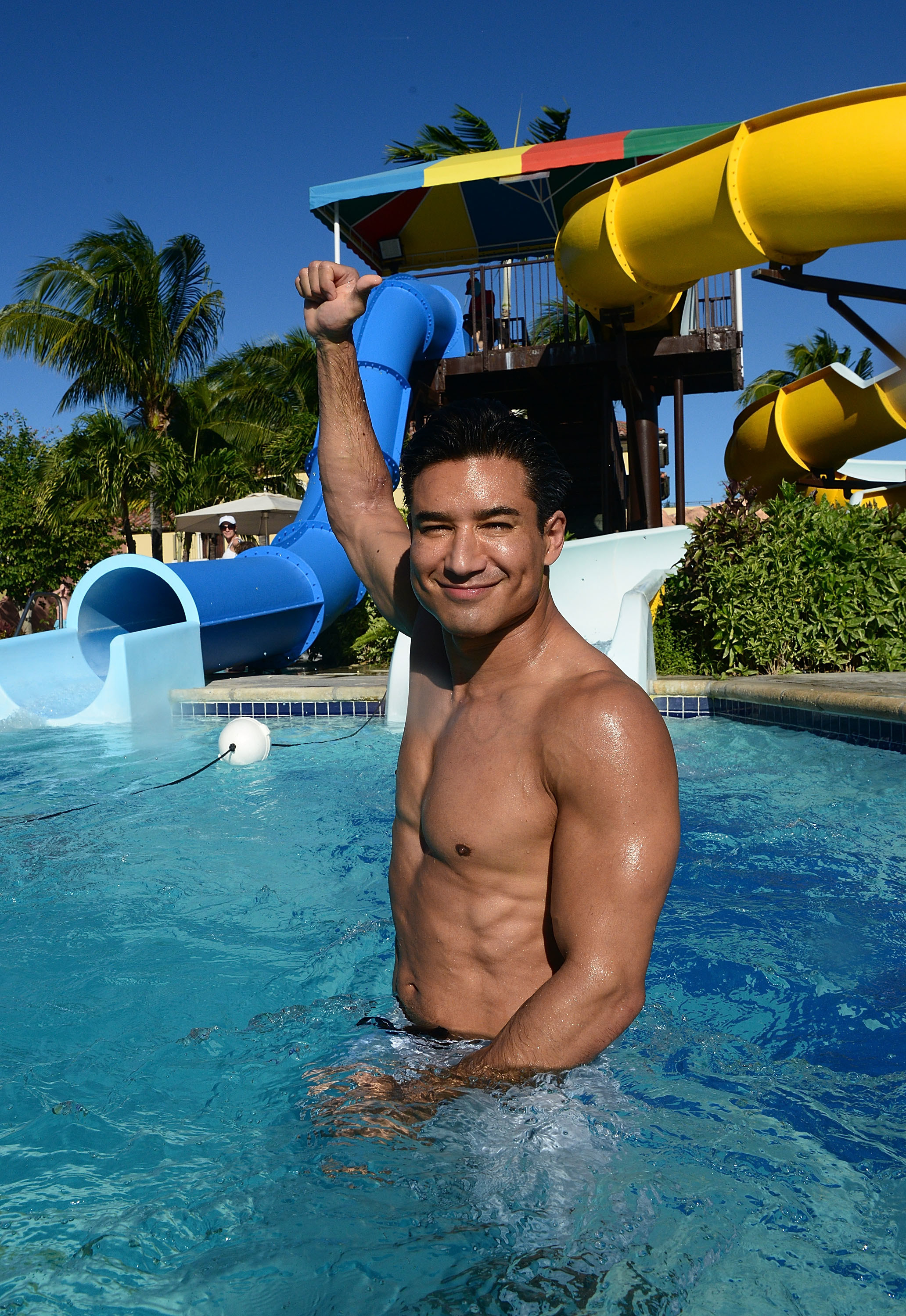 Mario shirtless in a pool