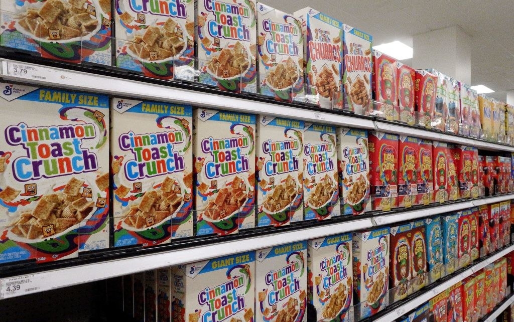 Boxes of Cinnamon Toast Crunch at a grocery store.