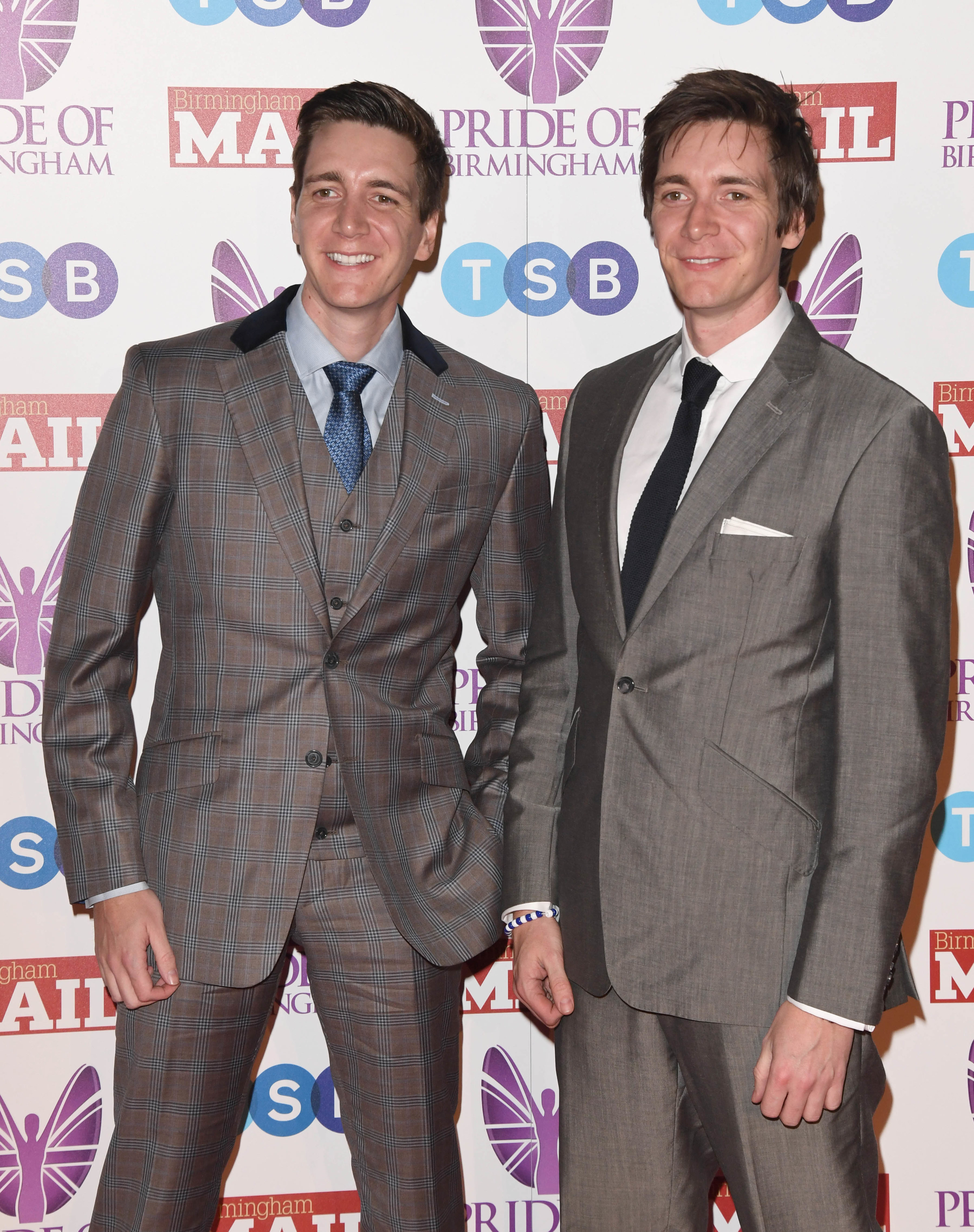 The Phelps twins smiling at a red carpet event