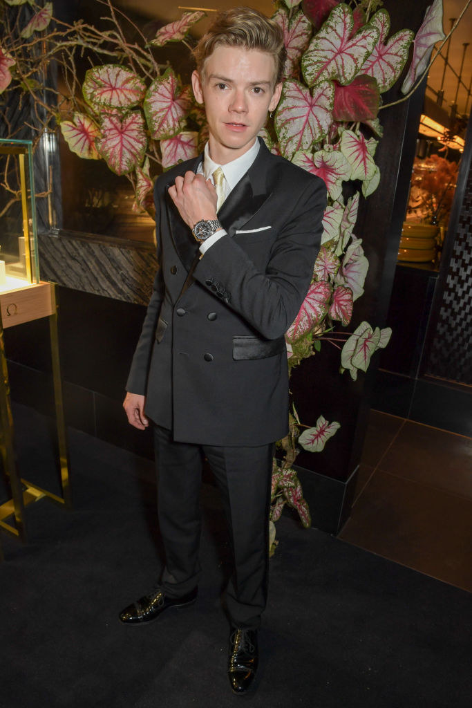 A much taller Thomas at an omega watch event in a suit