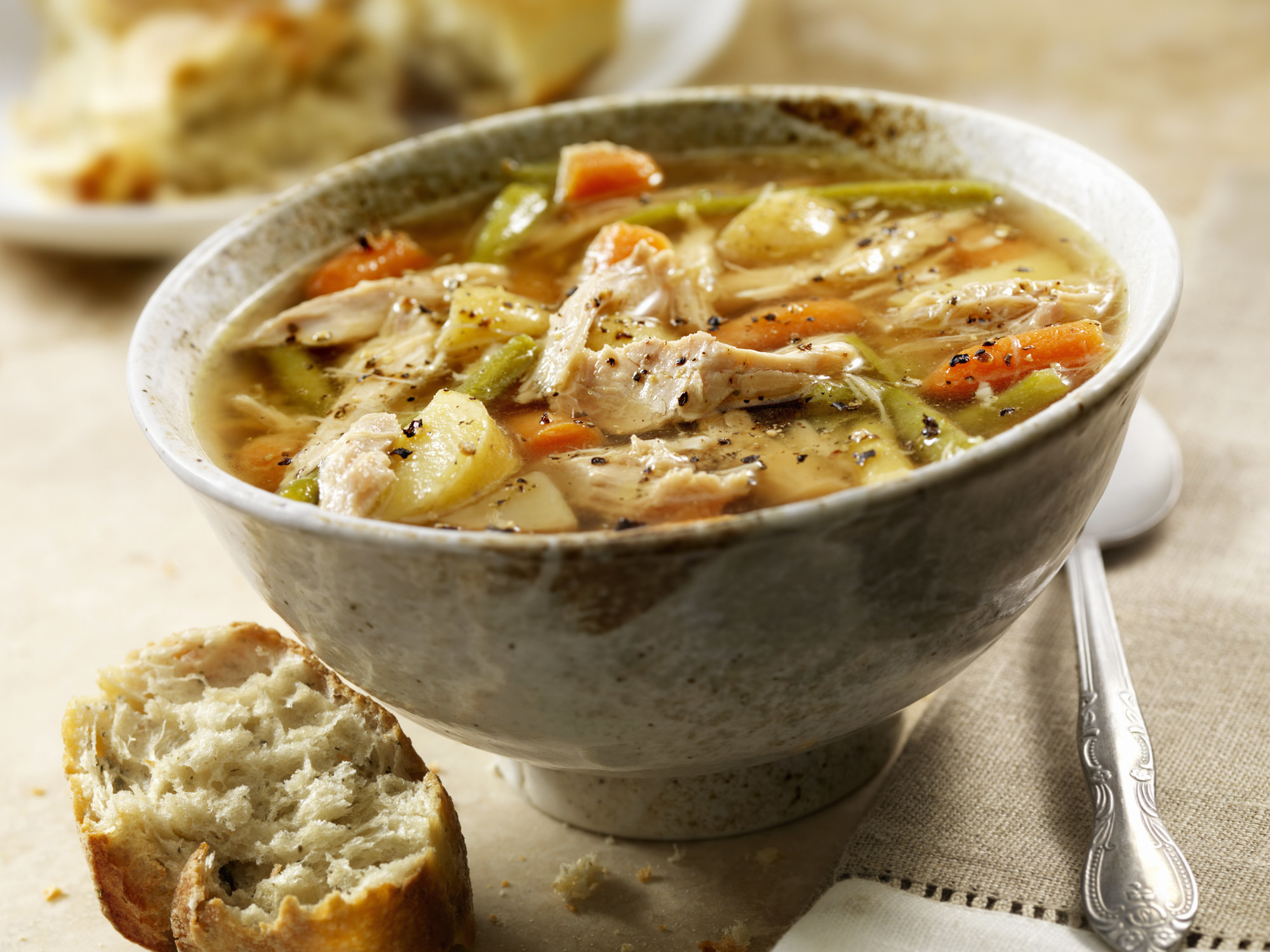 Homemade chicken soup with carrots and celery.