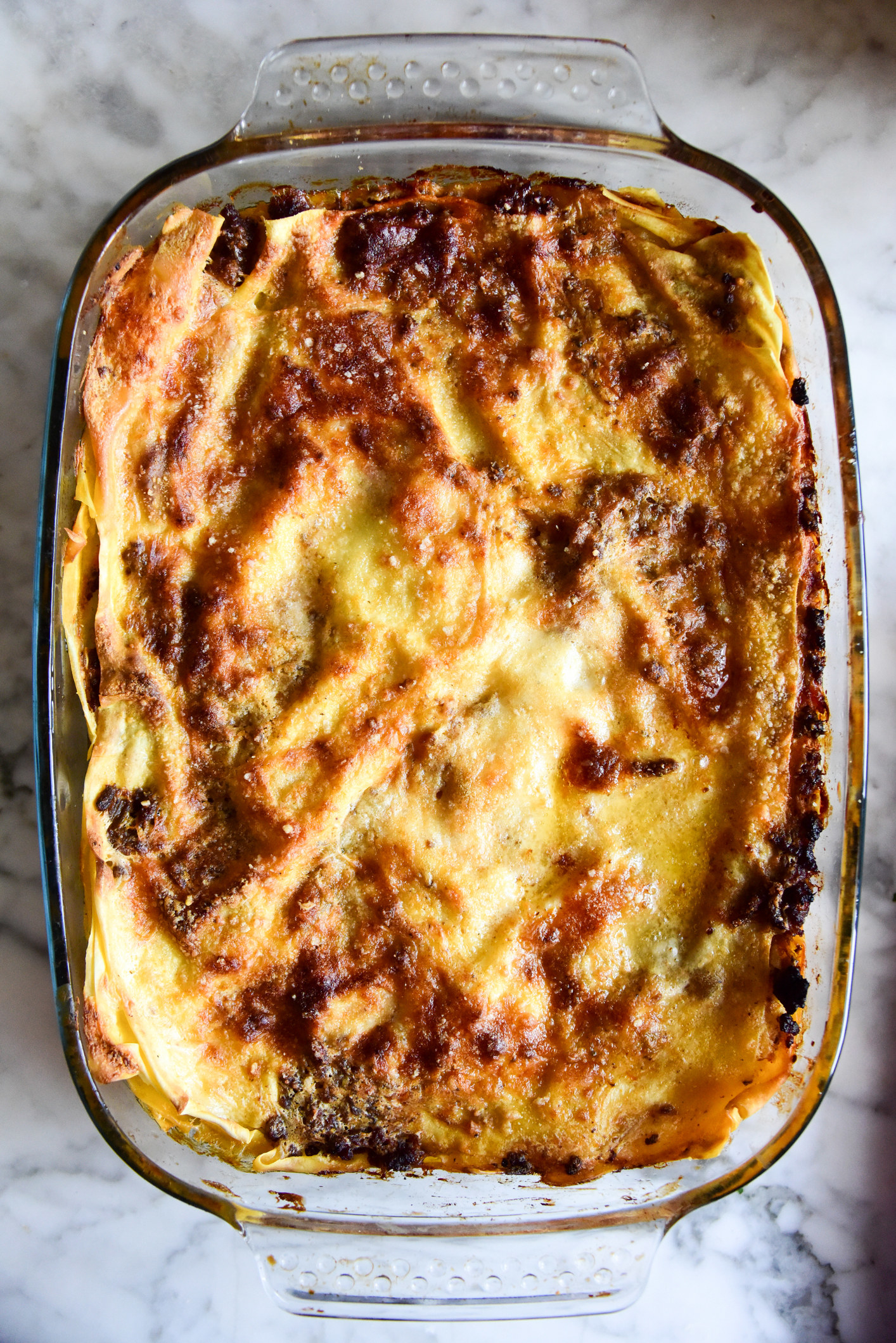 A homemade lasagna in a baking dish.