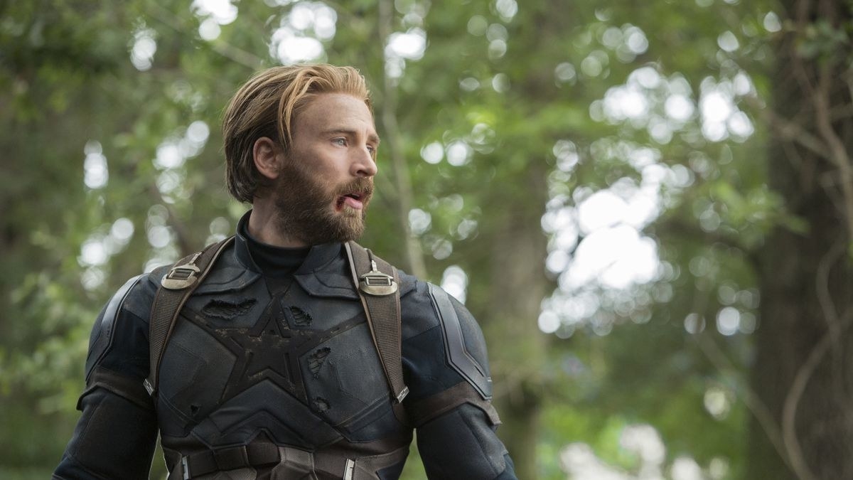 Captain America wearing his dark blue suit in the forest 