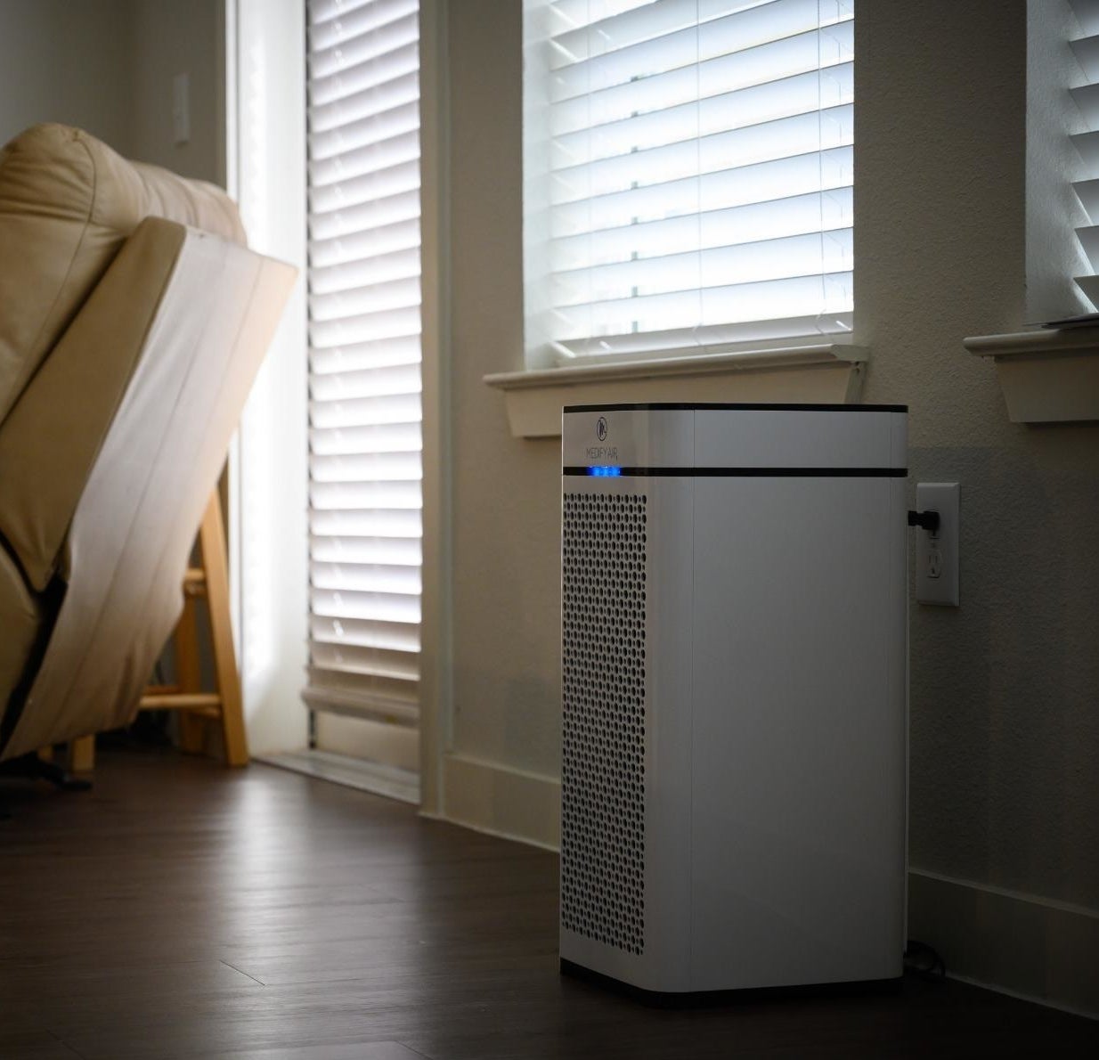 reviewer image of the white air purifier in a living room