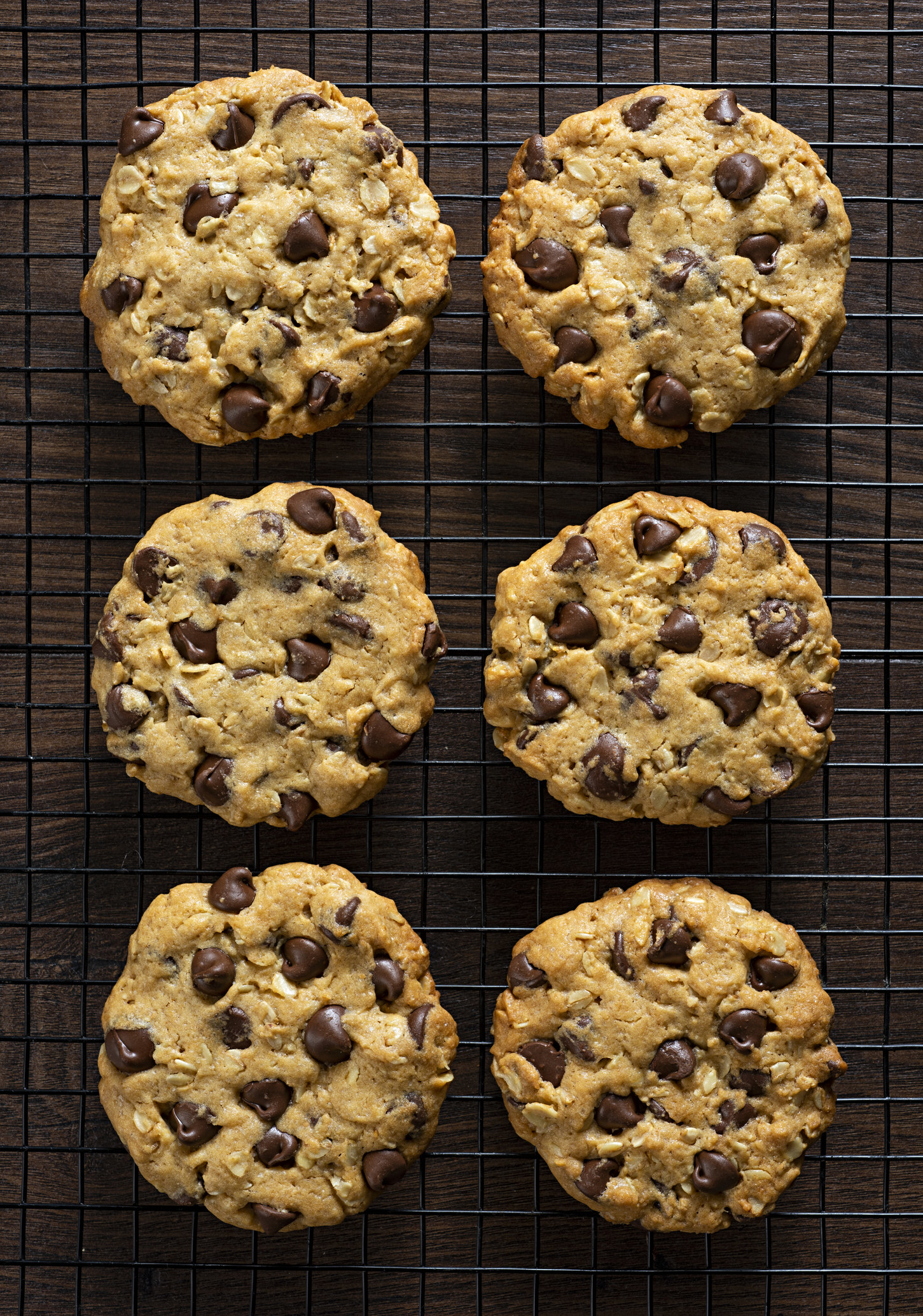 Chocolate chip cookies on a wire rack.