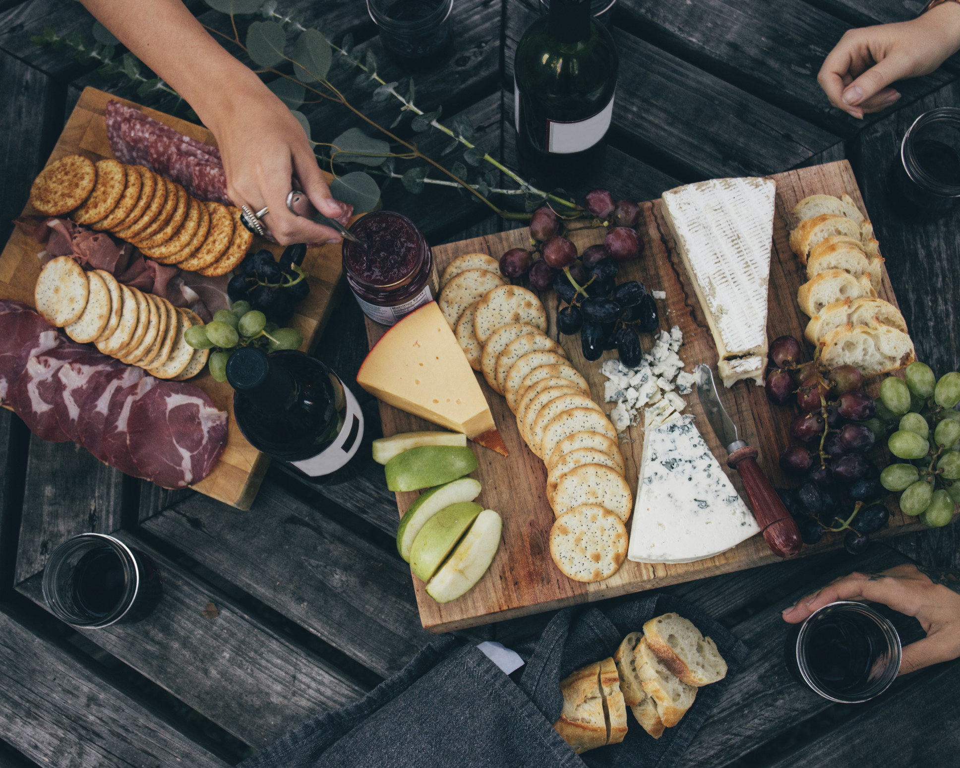 Two cheeseboards on a table