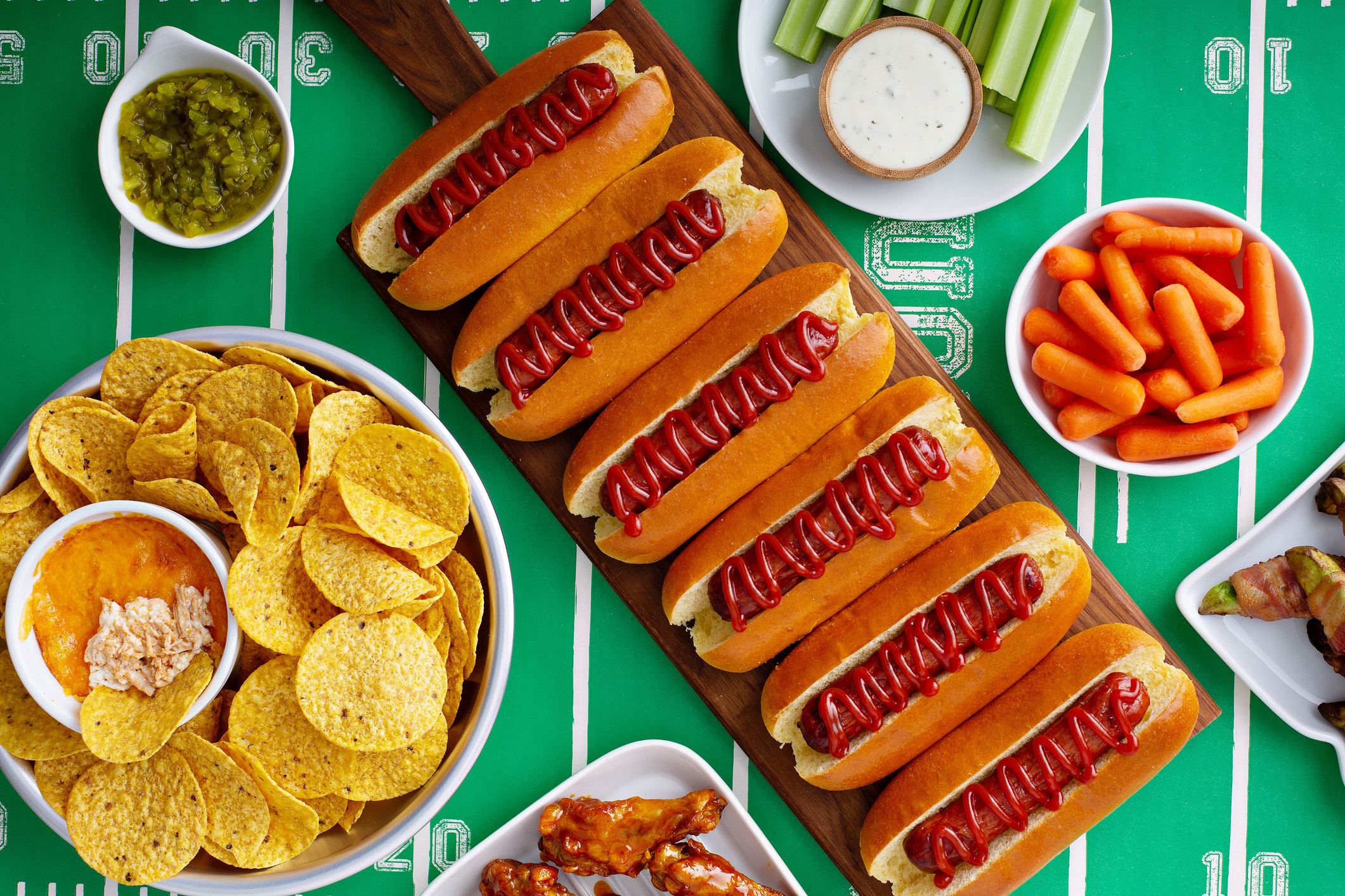 An aerial view of hotdogs and appetizers