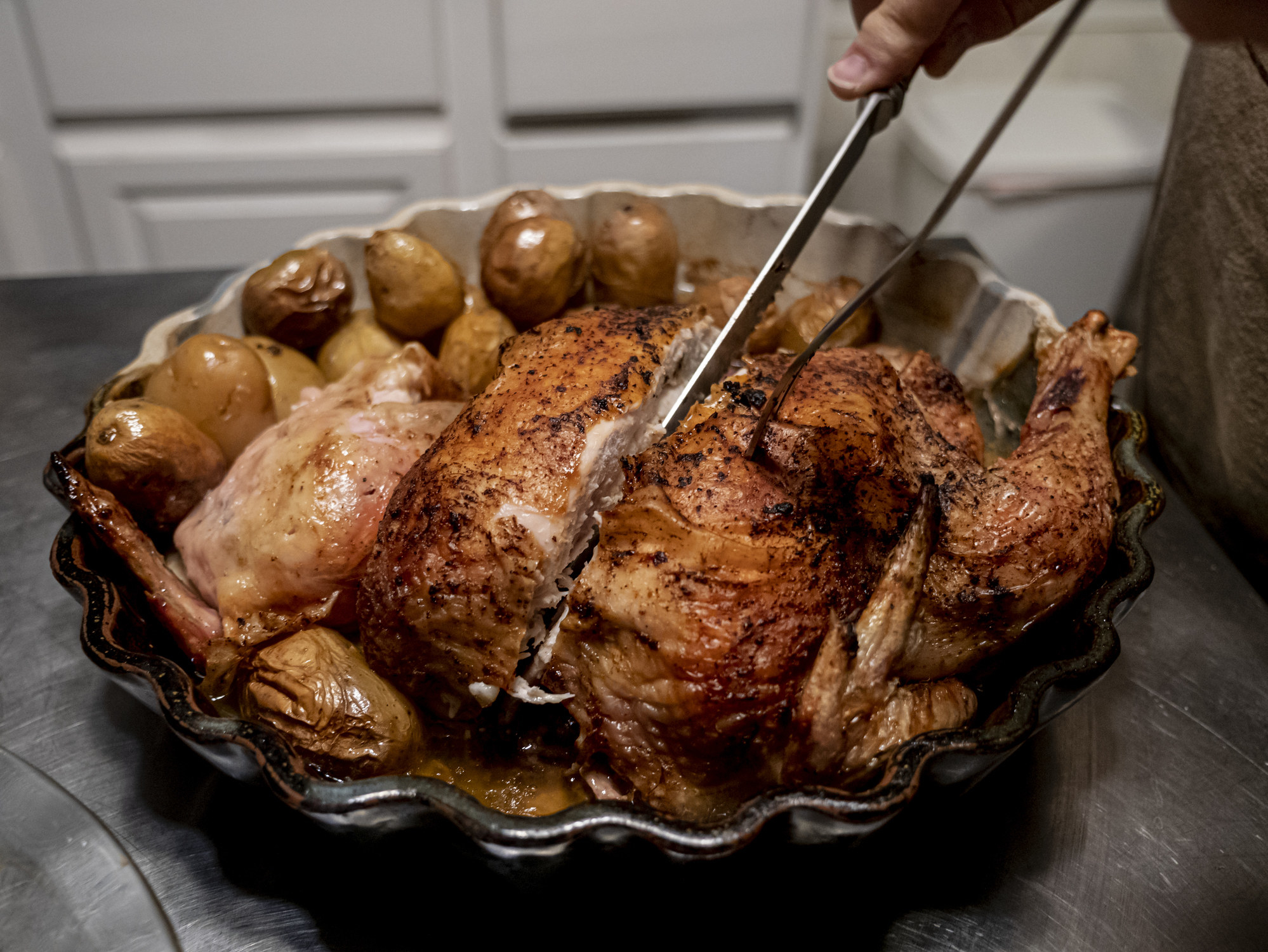 Slicing a roast chicken.