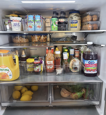 the same fridge organized with the clear containers