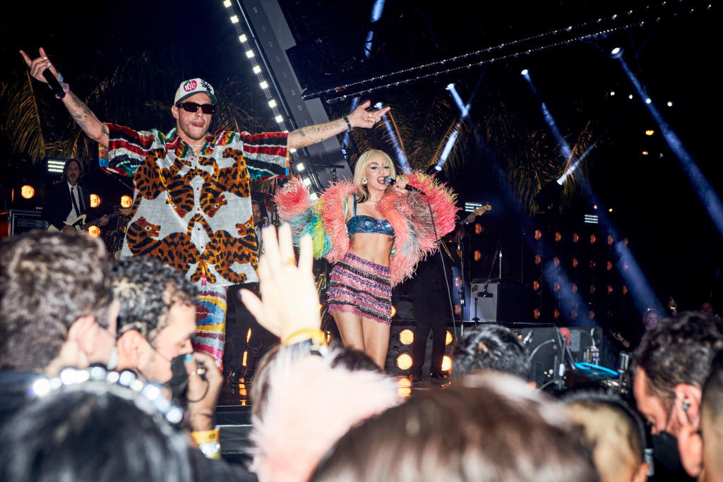 Peter onstage with Miley Cyrus